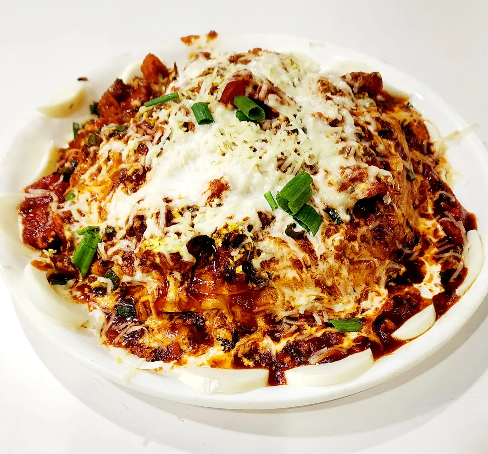 Evershine Special Rice — the house signature dish, topped with grated cheese, spring onions and rich red gravy
